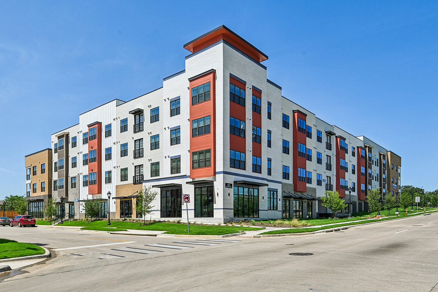 A four story square building comprised of one and two-bedroom apartments.